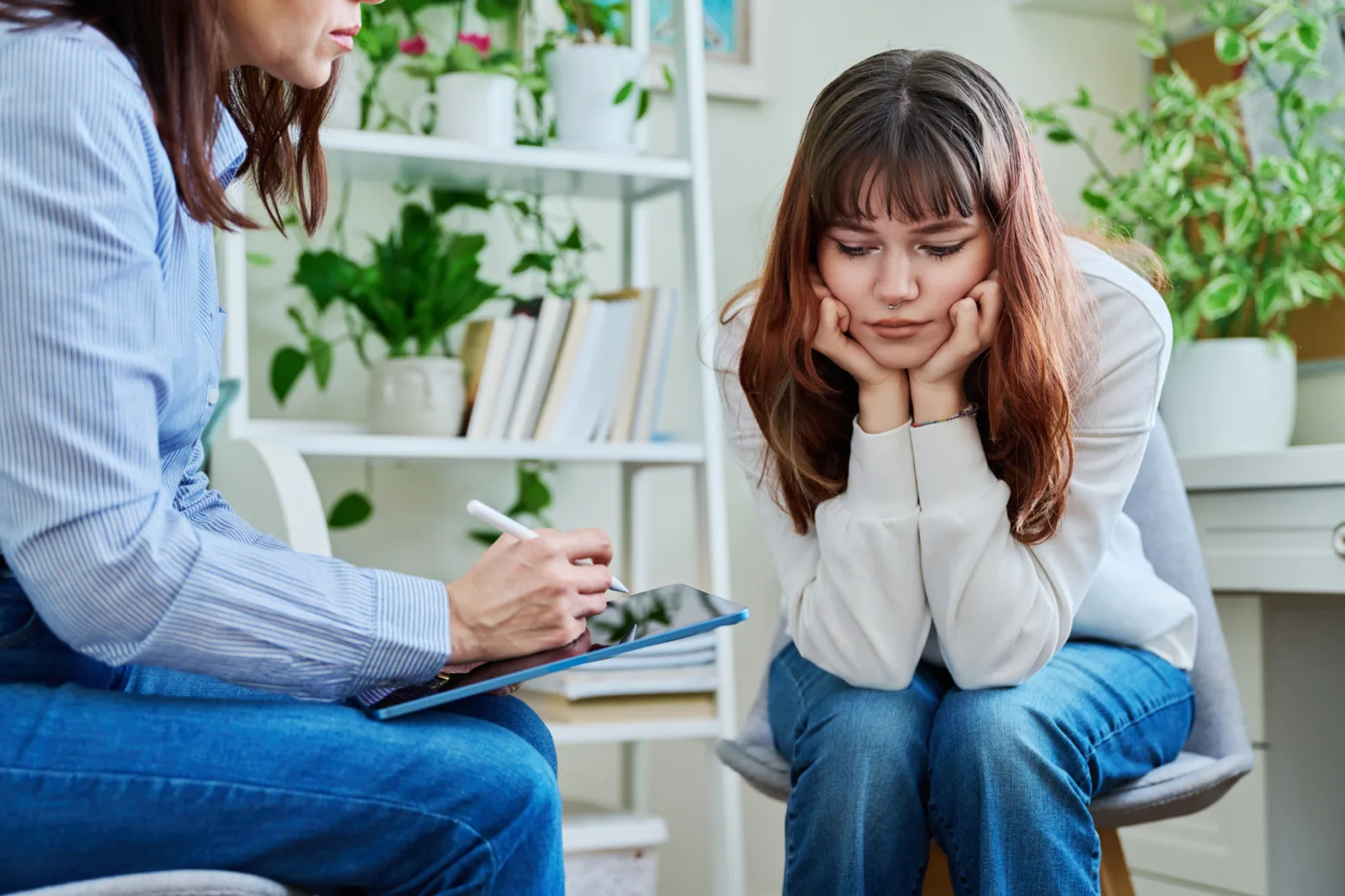 Mp64419803 sad serious teenage girl at session in office of mental
