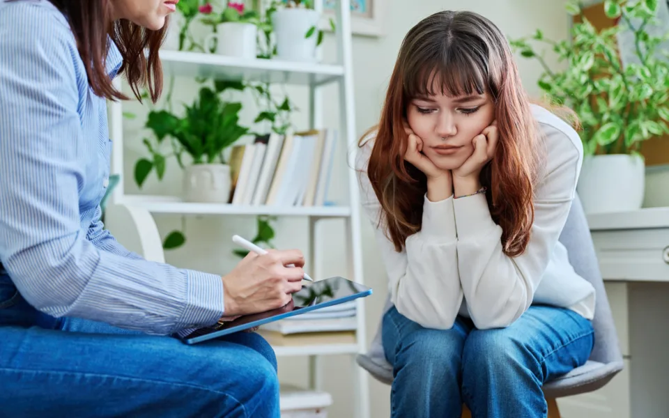 Mp64419803 sad serious teenage girl at session in office of mental